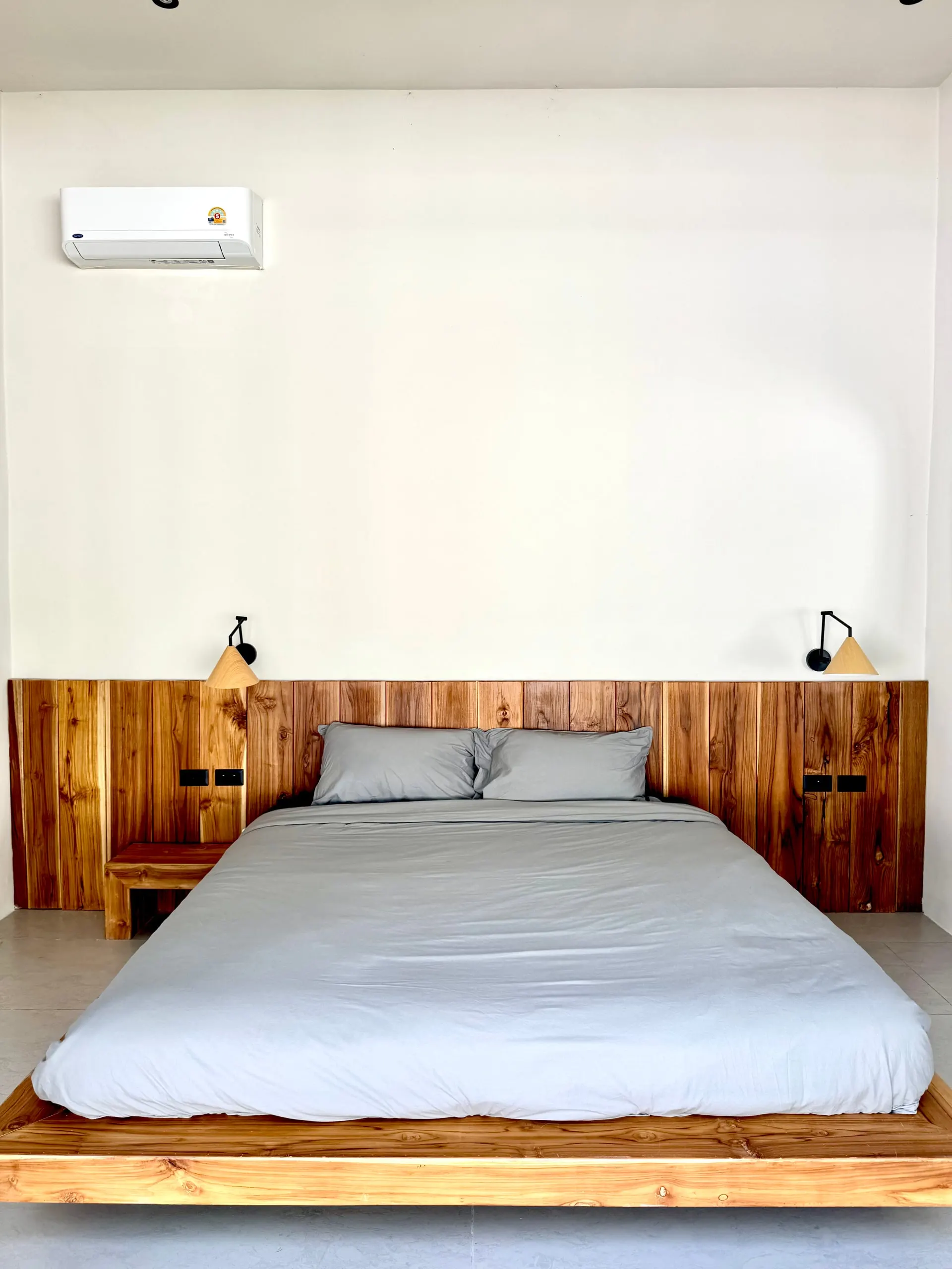Villa II — bedroom two, platform bed with grey linens