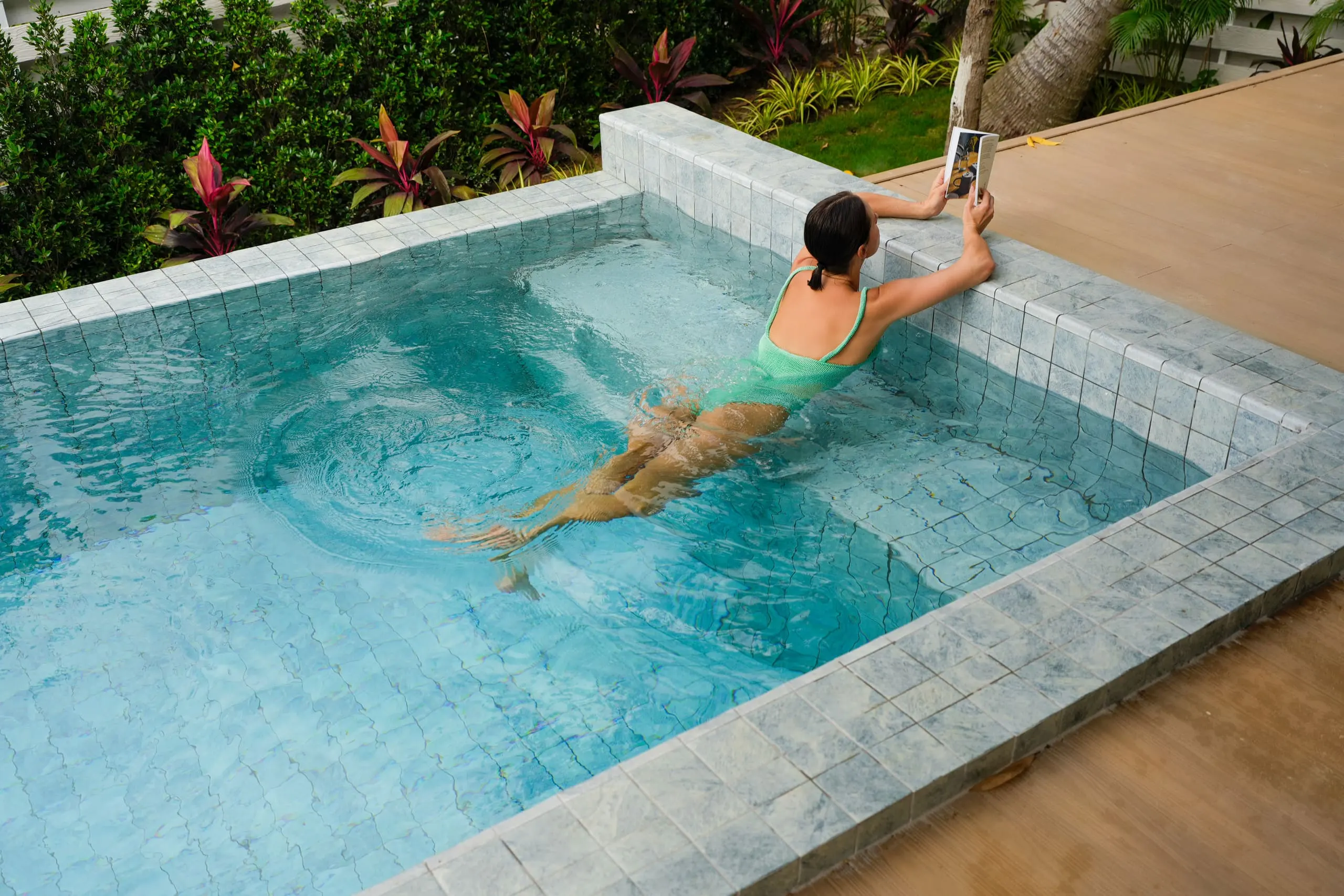 Villa II — turquoise pool and sun deck beside the covered terrace