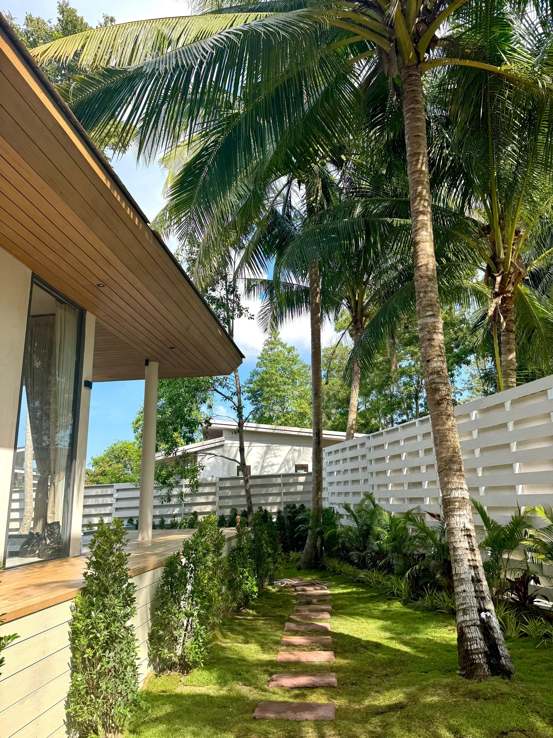 Villa II — covered walkway along the side garden